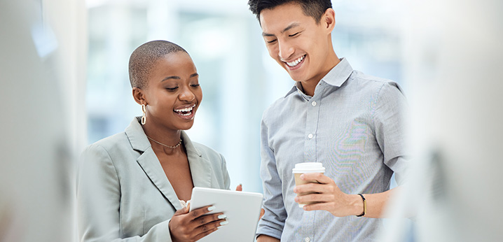 Two associates looking over notes.